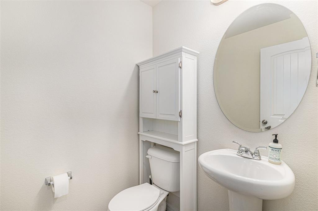 Image 16 of 33: Bathroom with a textured wall