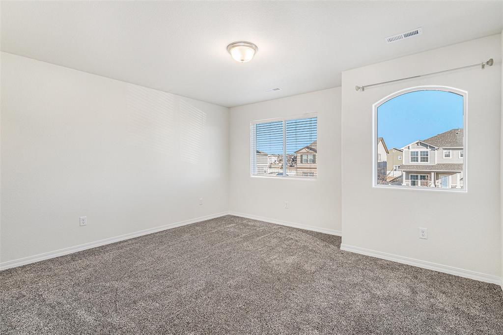 Image 17 of 33: Unfurnished room featuring carpet and baseboards