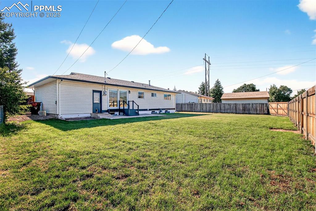Image 18 of 21: Generous 23x10 Back Patio, RV Gate In The Far Right Corner With Alley Acces