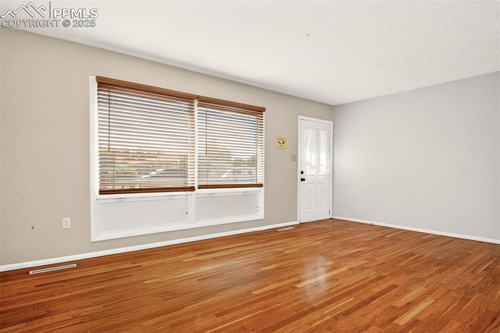 Image 2 of 21: Entrance, Hardwood Flooring In The Living Room