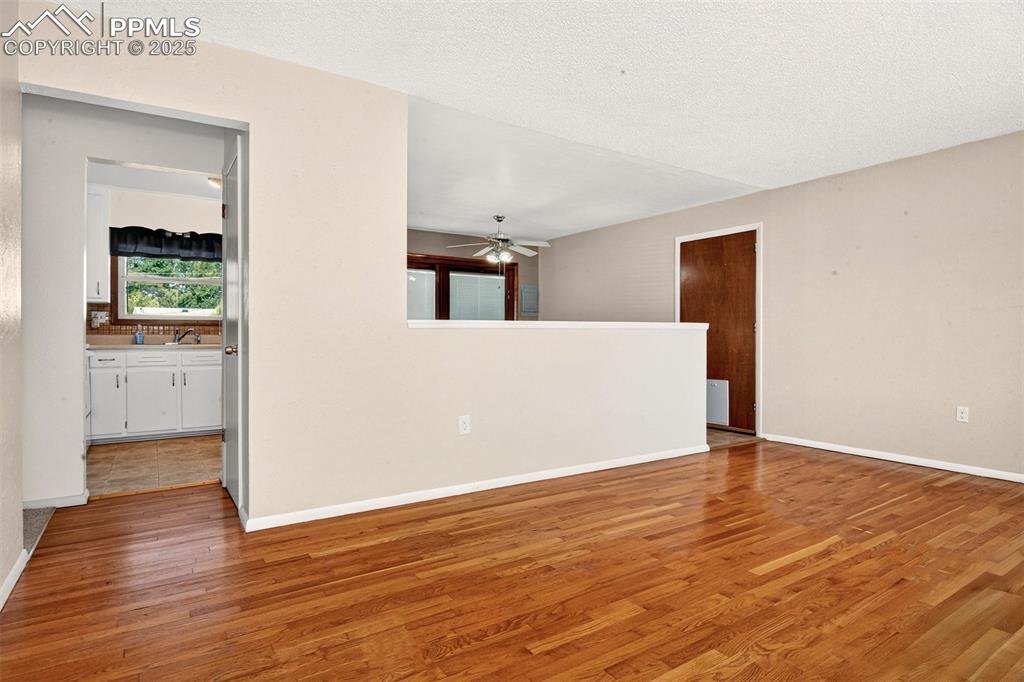 Image 3 of 21: Entry To The Eat-In Kitchen, Garage Entrance To The Right.