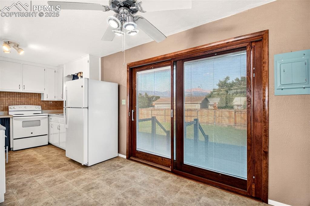 Image 5 of 21: Ceiling Fan in Dining Niche, Views Of Pikes Peak From The Back Patio and Wi