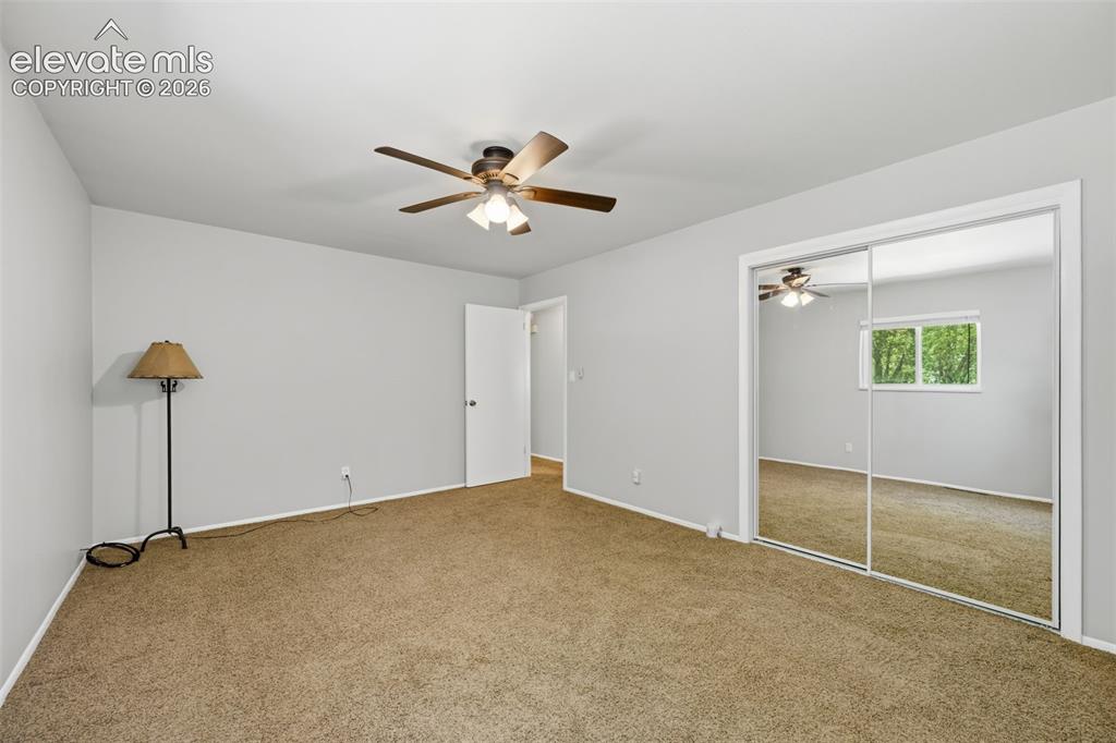 Image 23 of 36: Neutral-toned carpeting and light gray walls create a versatile interior