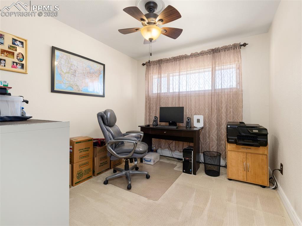 Image 14 of 39: Carpeted office featuring ceiling fan