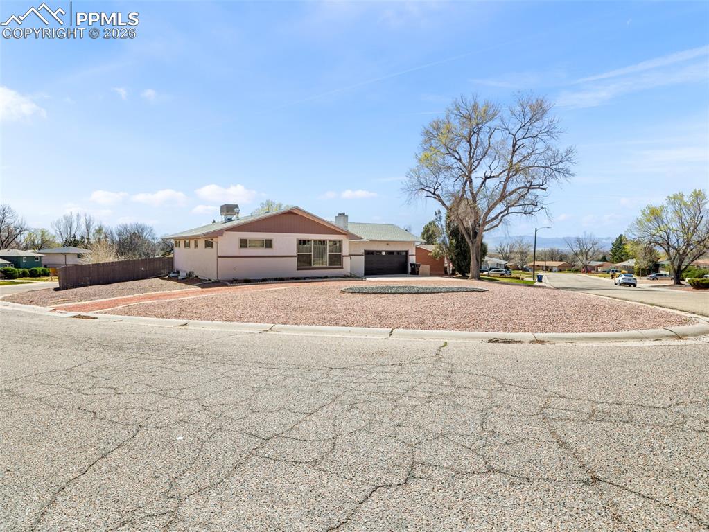 Image 2 of 39: Rancher home featuring concrete driveway with attached 2 car garage