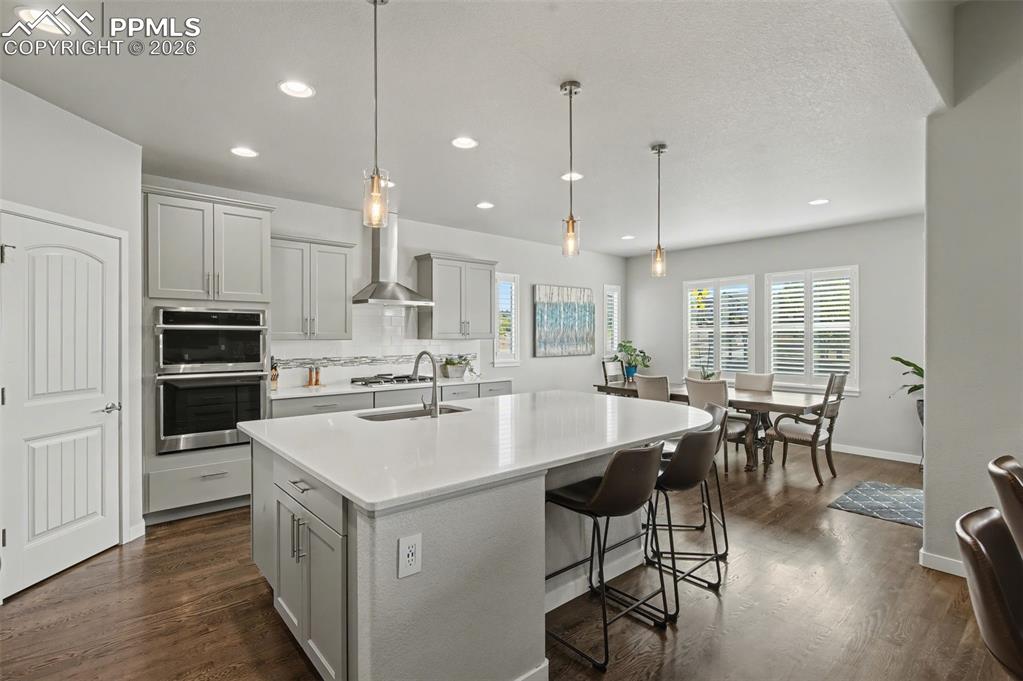 Image 10 of 50: Large kitchen with corner pantry
