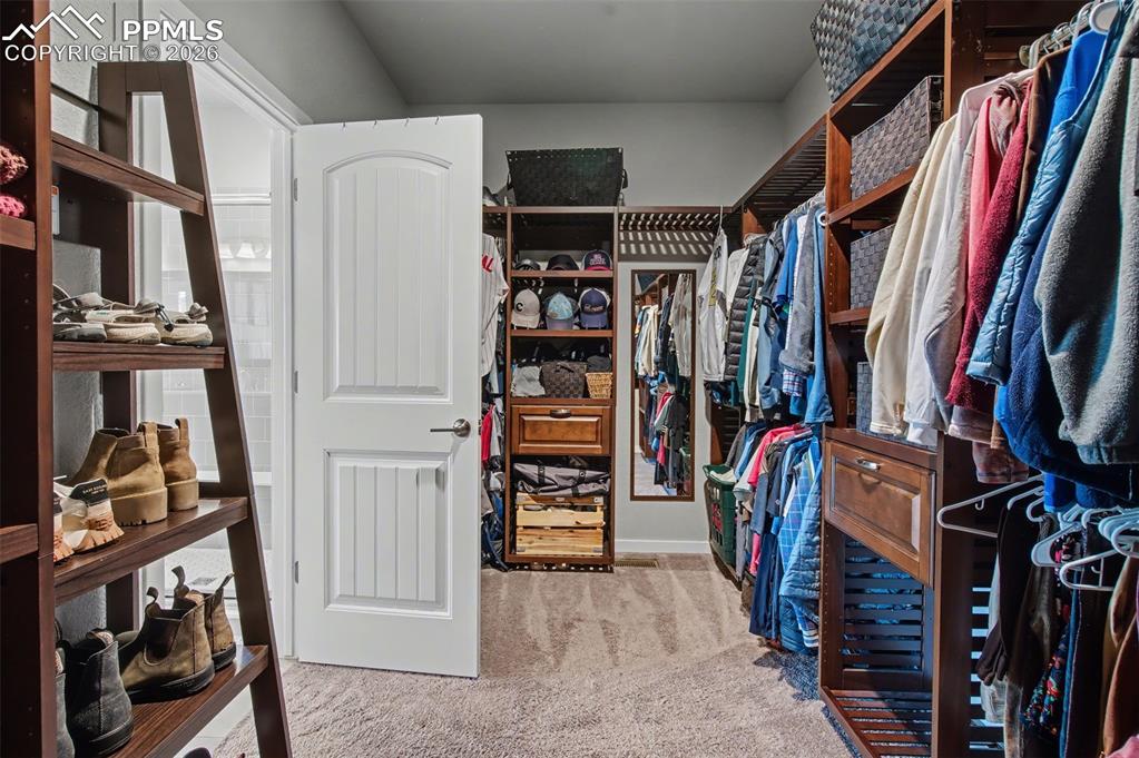 Image 23 of 50: Custom walk in closet!