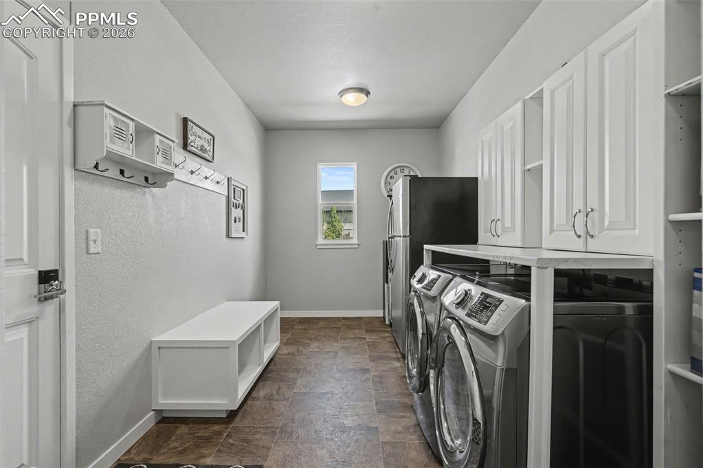 Image 28 of 50: Huge laundry and mud room!