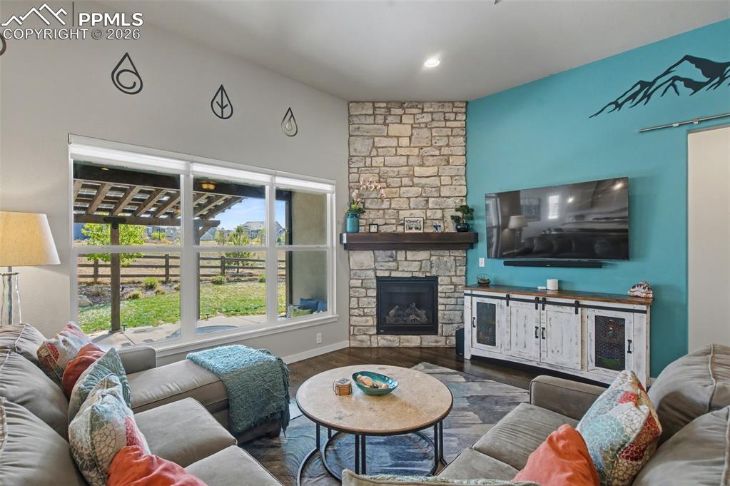 Image 7 of 50: Stone faced fireplace with mantle