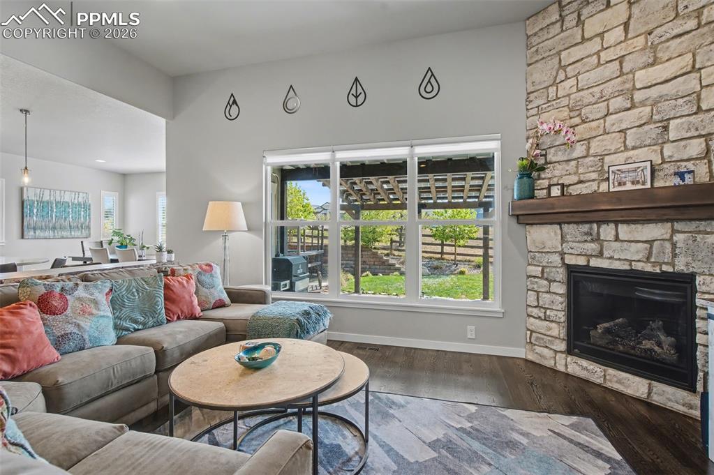 Image 8 of 50: Stone faced fireplace with mantle