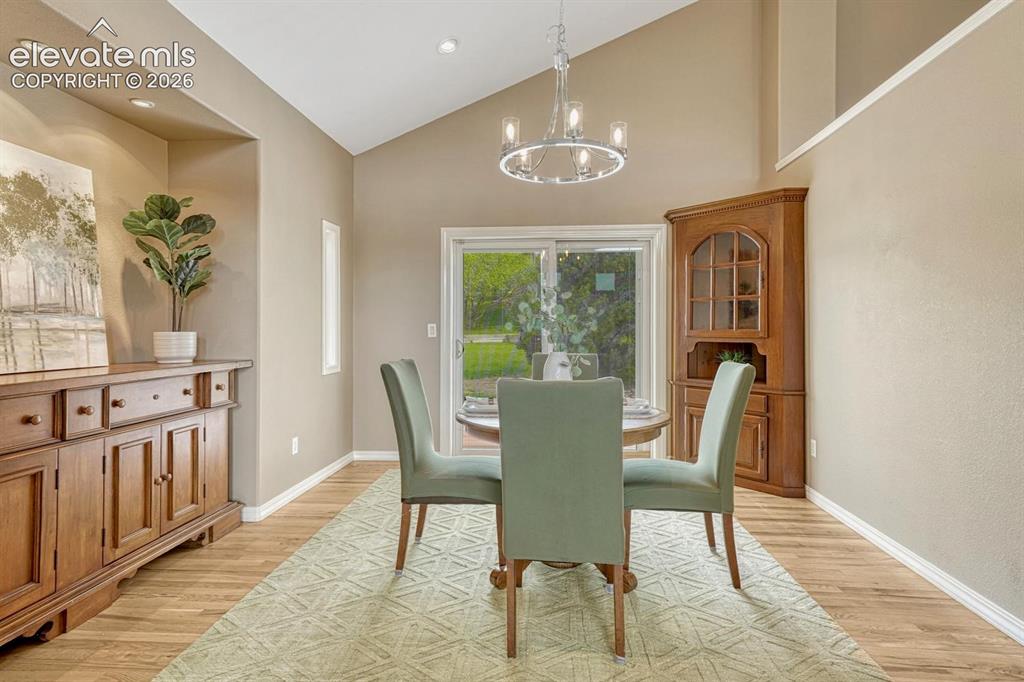 Image 16 of 50: Beautiful and open dining room with walkout to back yard