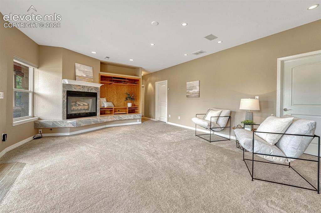 Image 31 of 50: Large rec room with potential to expand and VIEWS with walkout.