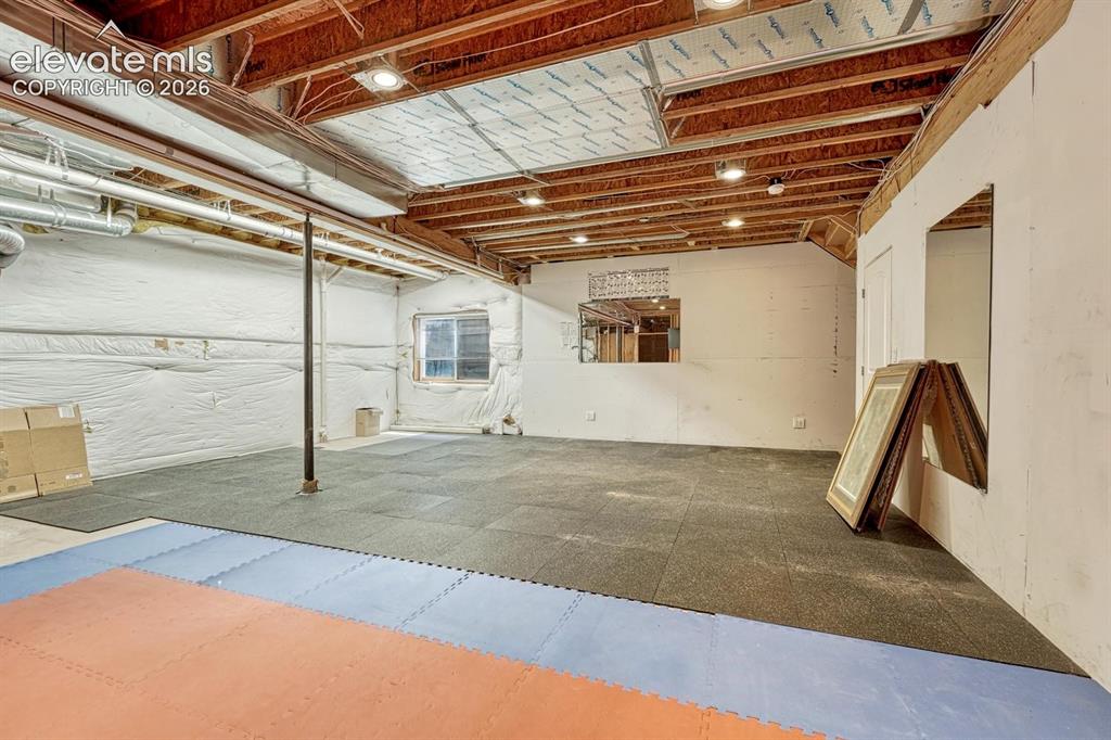 Image 41 of 50: Storage, workout room or expand the basment living area...bedroom #6? You