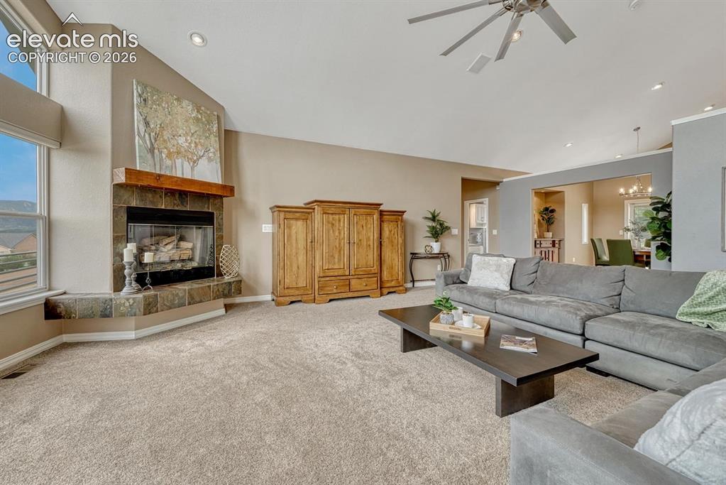 Image 8 of 50: Soaring ceilings complement the soaring mountain views in the great room.
