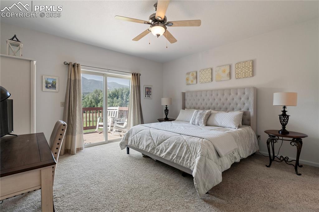 Image 16 of 27: The primary suite has a private entrance to the incredible deck.