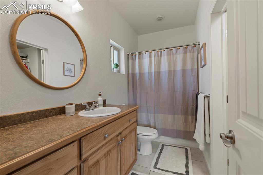 Image 19 of 27: The master bathroom has tiled floors.