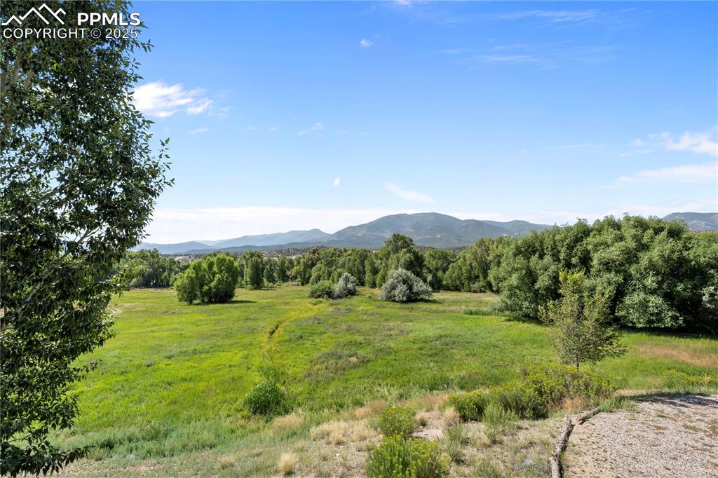 Image 2 of 27: This unit backs to open space, the little Arkansas River, and peace and ser