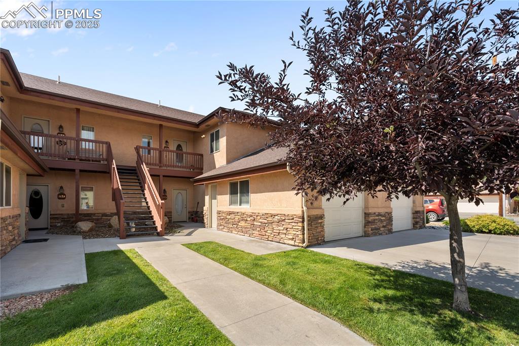 Image 27 of 27: This 2nd story unit has a detached garage and dedicated storage unit.
