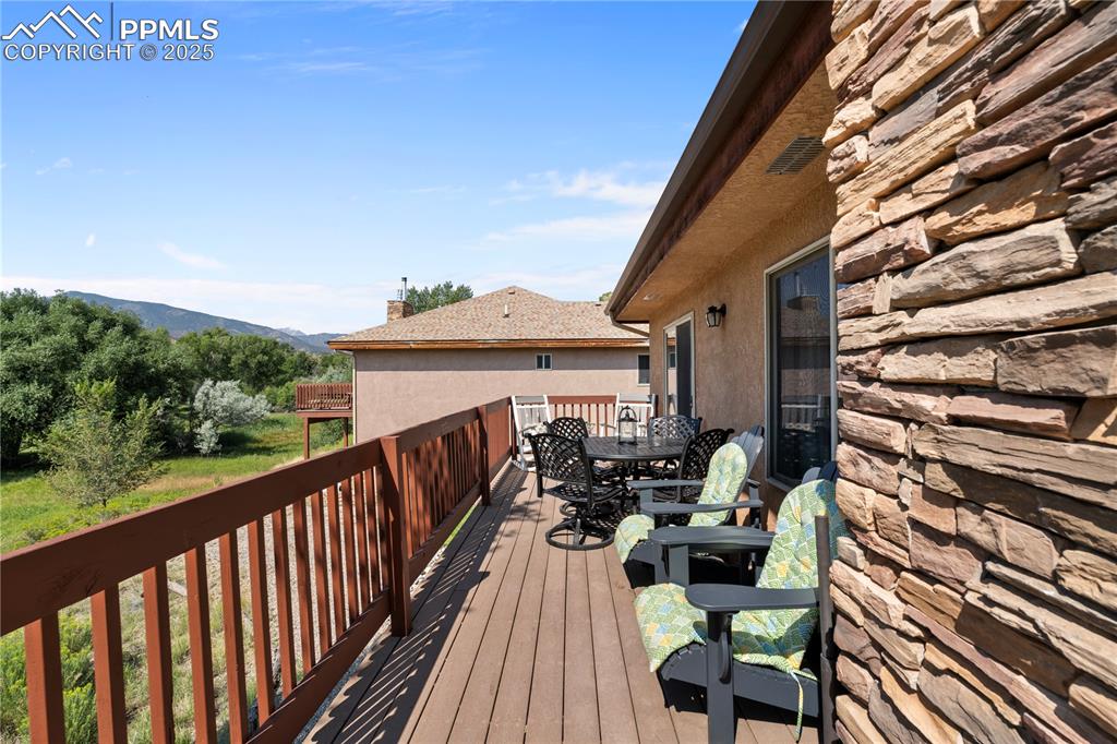Image 4 of 27: You can enter the deck through the dining area or from the Primary Bedroom.