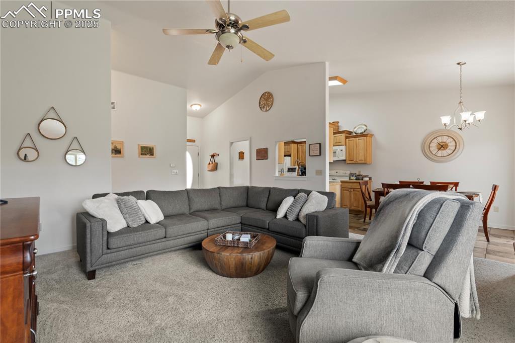 Image 6 of 27: The living room is bright and open.  You will love the open concept.