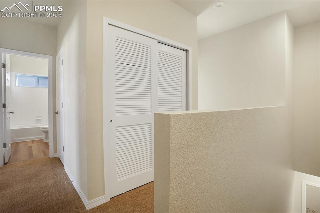 Image 32 of 48: Laundry closet on upper level