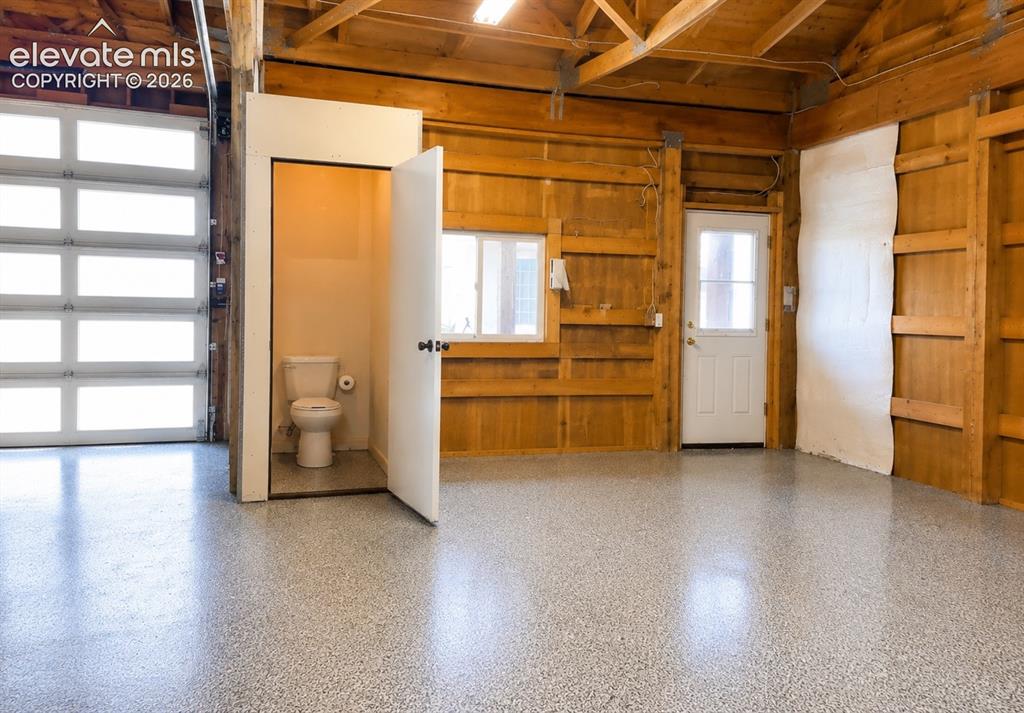 Image 36 of 38: inside detach garage showing toilet/plumbing