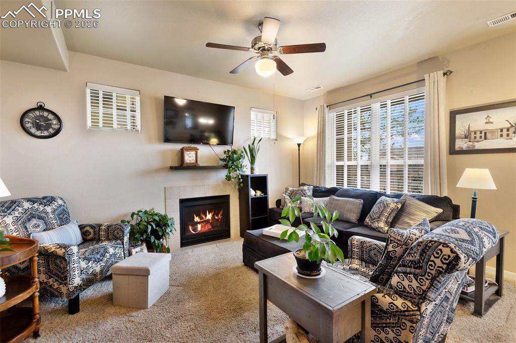 Image 8 of 29: Living Room with views of Pikes Peak