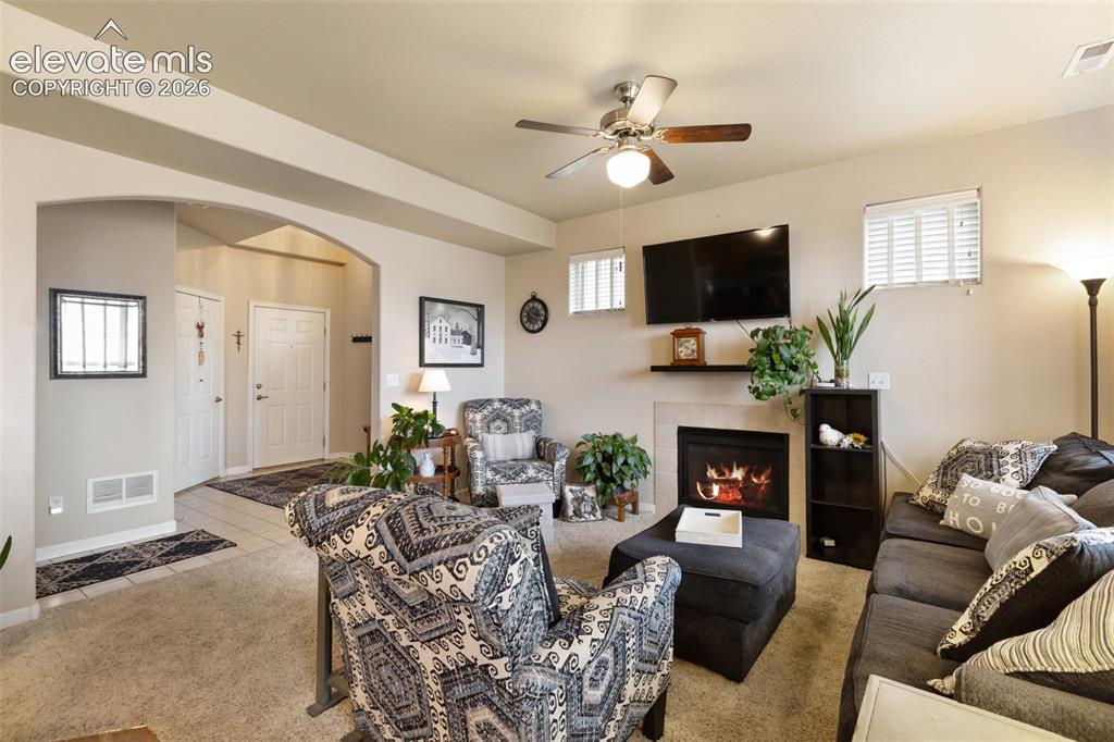 Image 8 of 29: Living Room with cozy fireplace