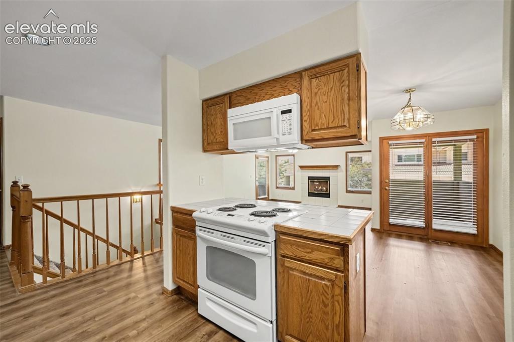 Image 11 of 47: Kitchen featuring new LVP flooring and integrated microwave