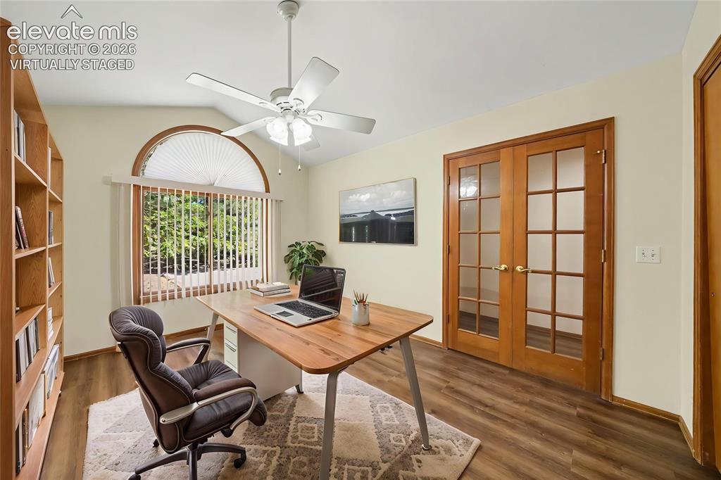 Image 15 of 47: Virtually Staged. Vaulted ceiling, arched window with vertical blinds, ceil