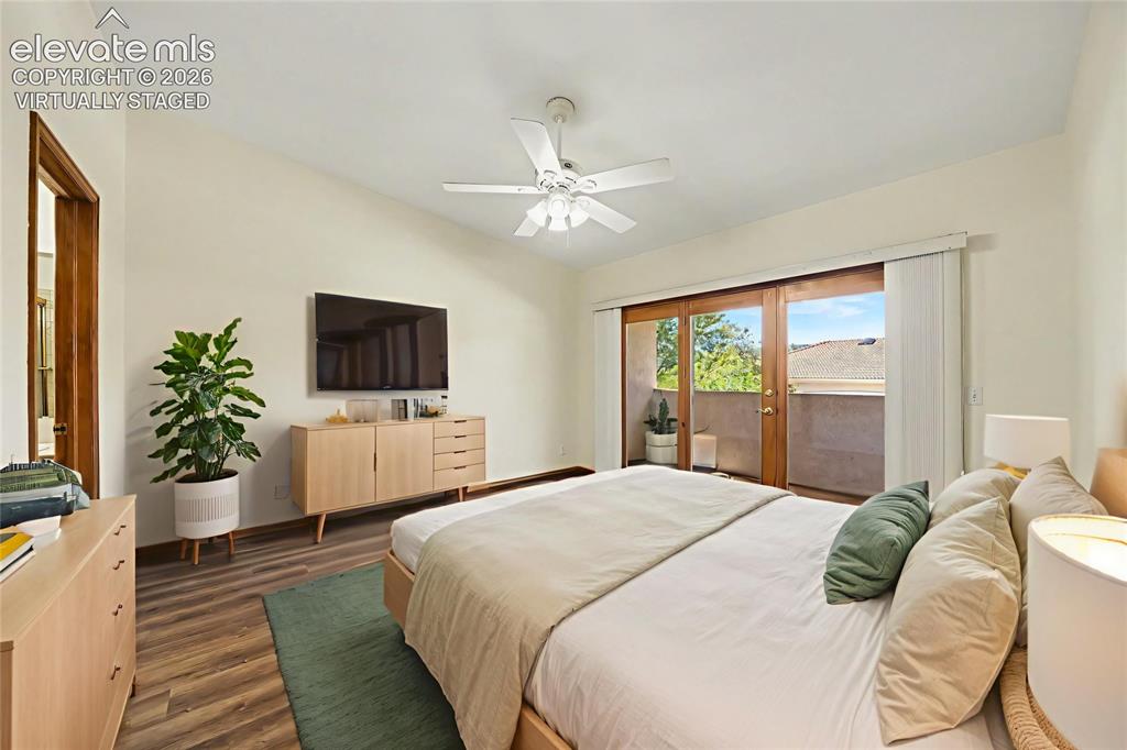Image 21 of 47: Virtually staged. Vaulted ceiling with a ceiling fan, LVP flooring, and sli