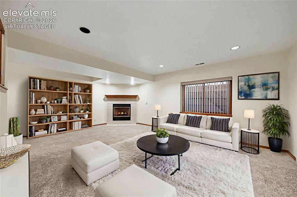 Image 29 of 47: virtually staged Recessed lighting, wood-finish window trim, and a built-in