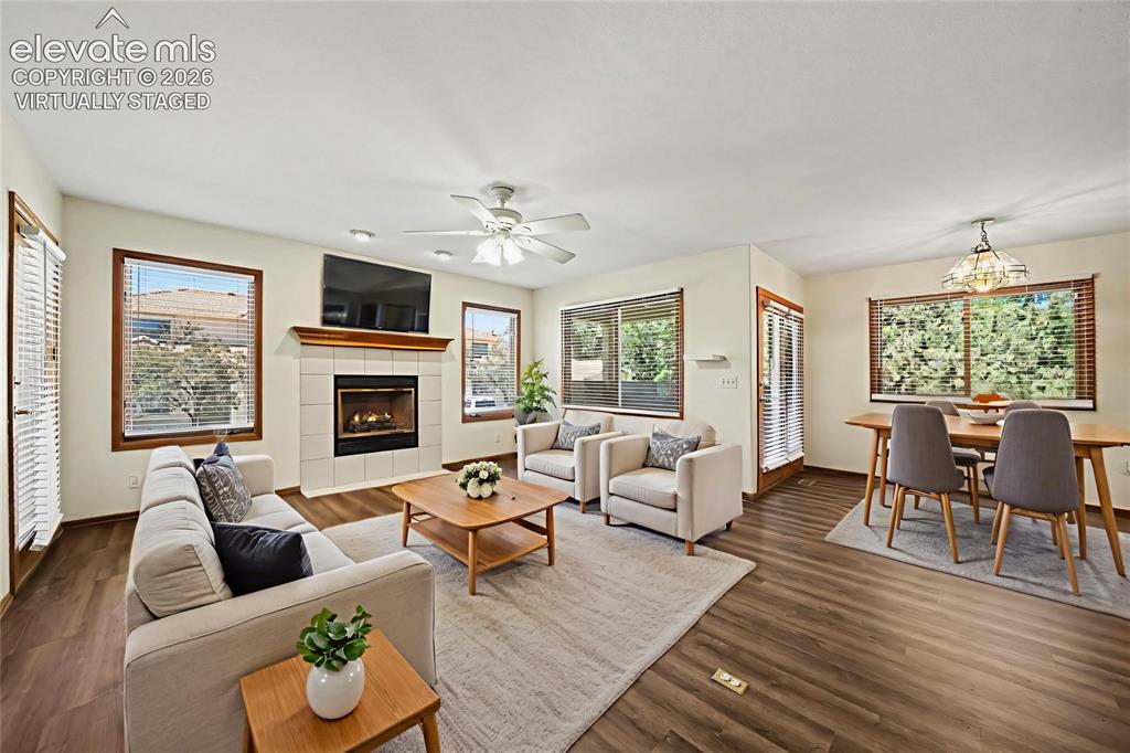 Image 3 of 47: Virtually Staged. Open-concept living space with new paint and LVP flooring