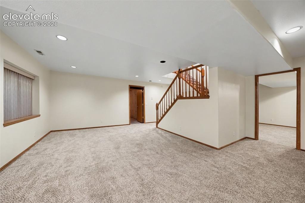 Image 31 of 47: new carpet in basement family room