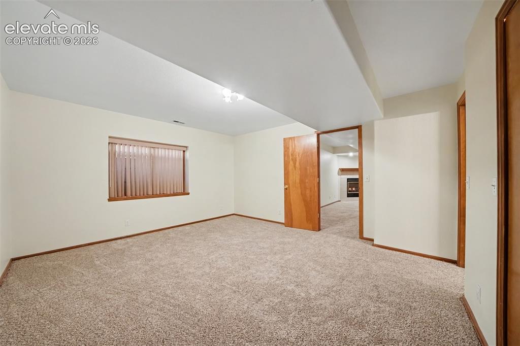 Image 34 of 47: Additional basement bedroom with new carpeting