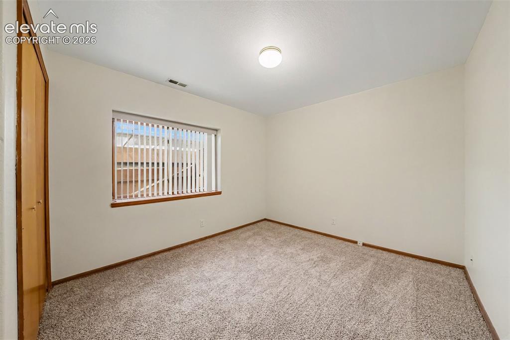 Image 35 of 47: Additional basement bedroom with new carpeting