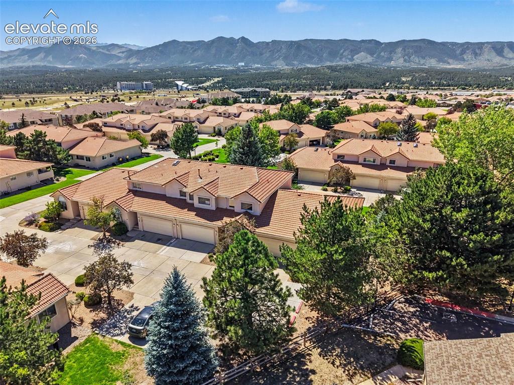 Image 47 of 47: Tile roofing and mature landscaping define this residential community, set 