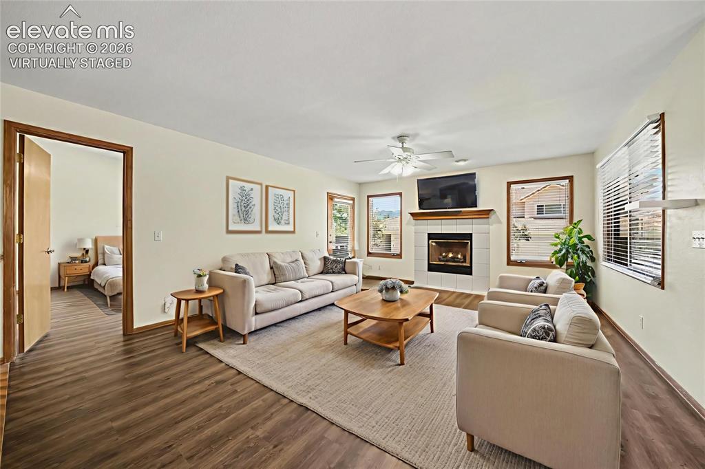Image 5 of 47: Virtually Staged. Spacious living area featuring new LVP flooring, a white-
