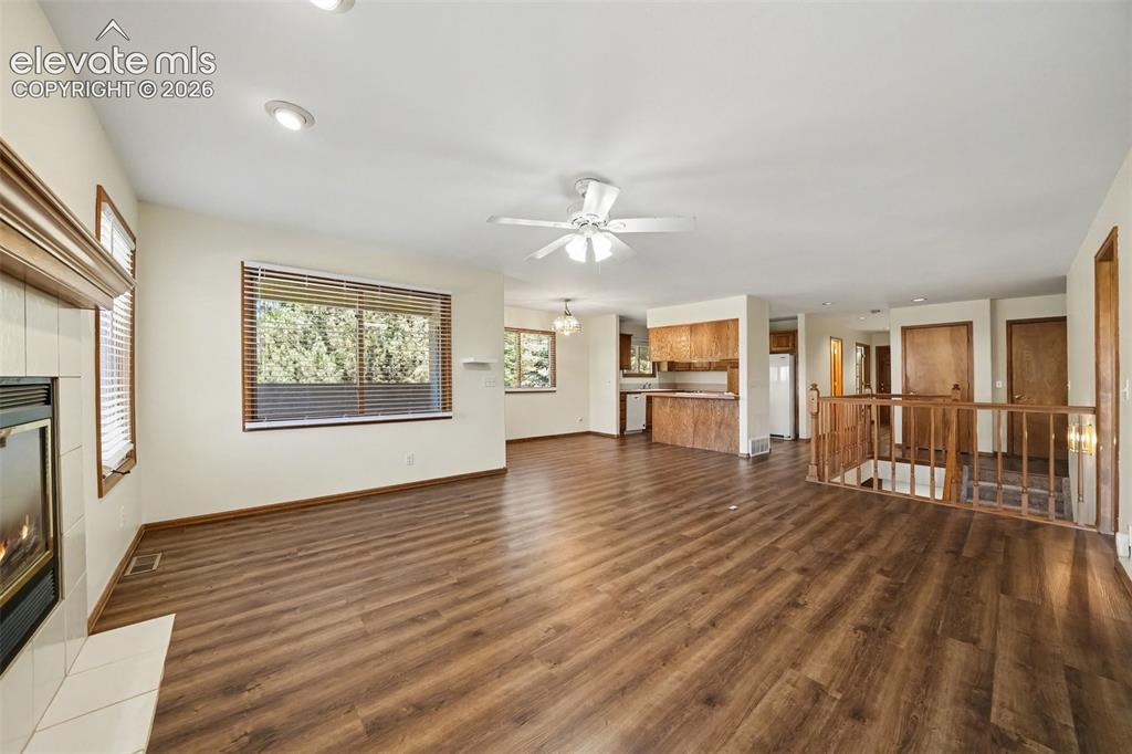 Image 7 of 47: Expansive living area featuring new LVP flooring, recessed lighting, and a 