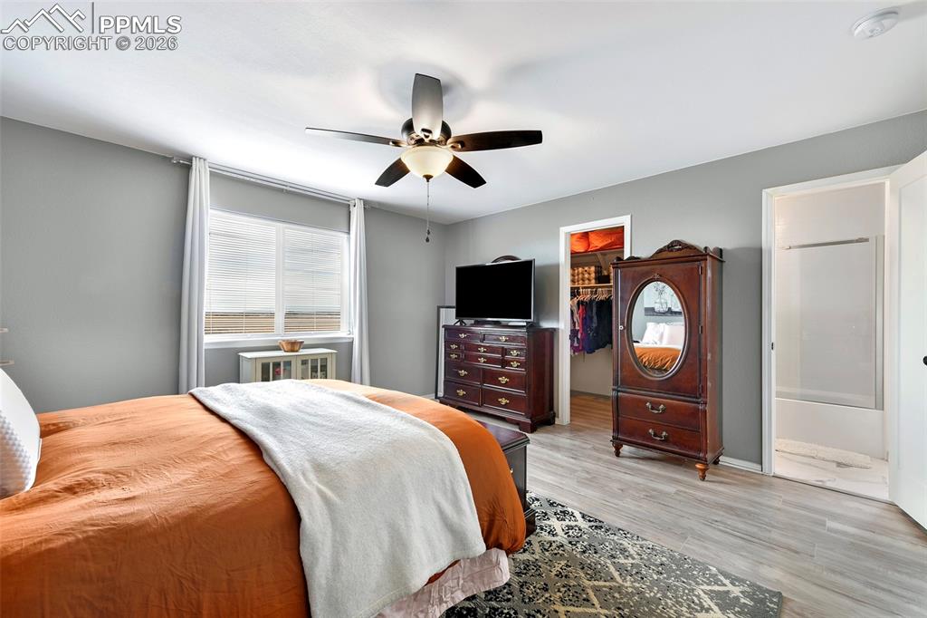 Image 17 of 30: Primary Bedroom With View Into Bathroom