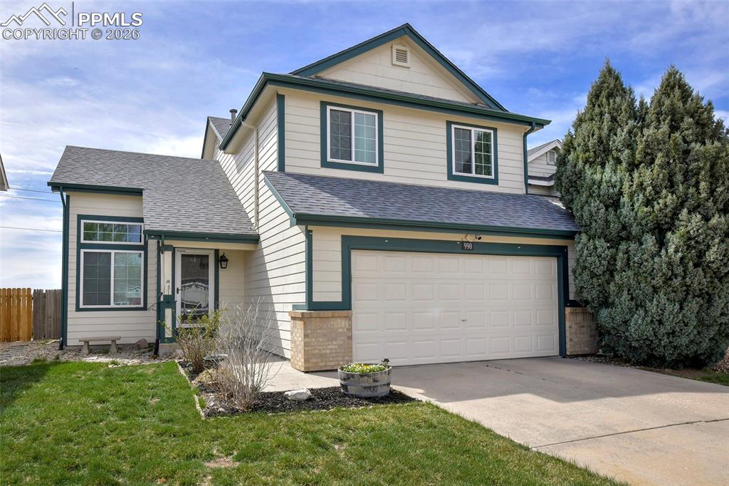 Image 2 of 30: Front Of Home With View Of Front Entrance And Driveway