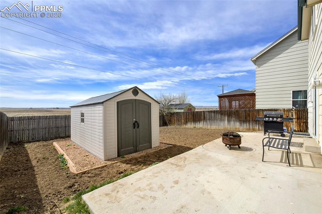 Image 3 of 30: Large Patio And Storage Shed