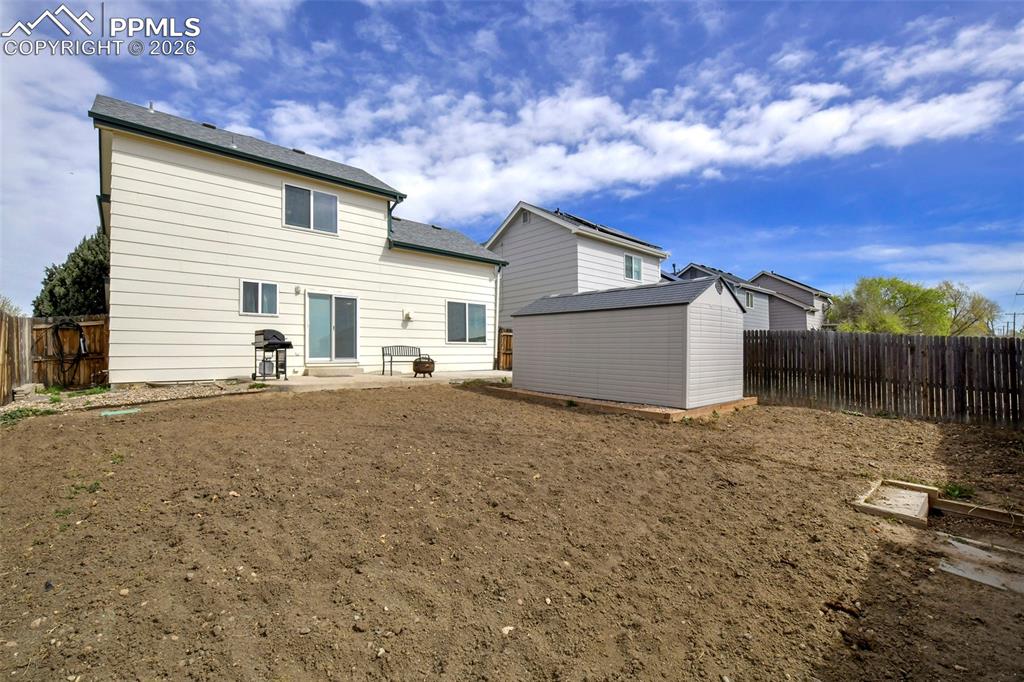 Image 30 of 30:  View Of Back Side Of The Home And Back Yard 