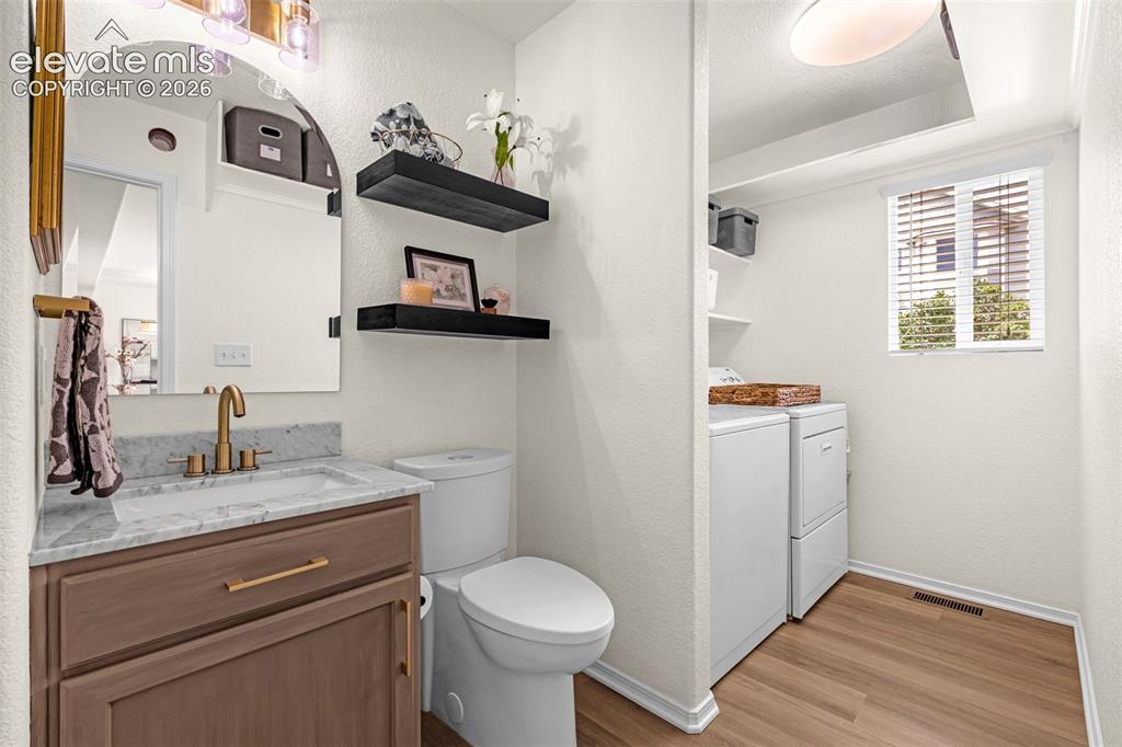 Image 16 of 44: Main Level 1/2 Bath & Laundry Room