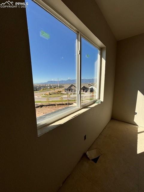 Image 10 of 14: Unfurnished room with a mountain view
