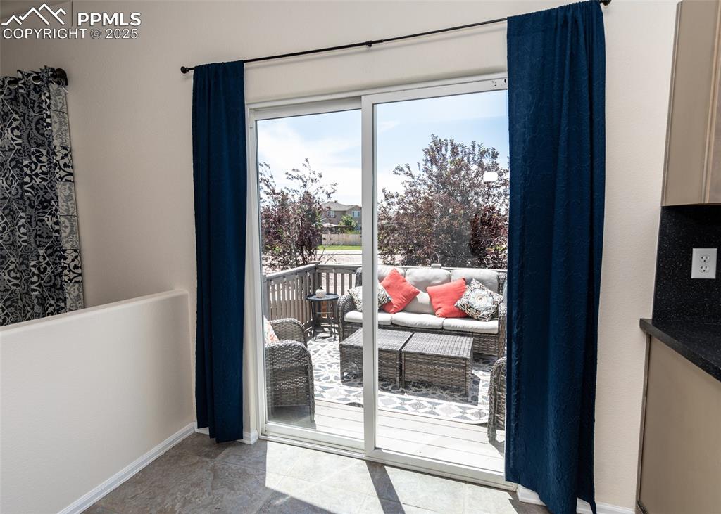 Image 11 of 50: View from dining nook to deck and backyard!