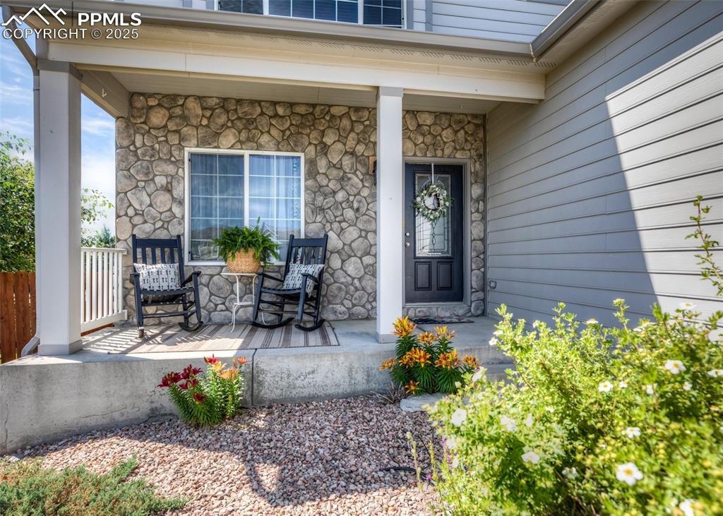 Image 2 of 50: Nice-Size Covered Front Porch with Stone Accent!