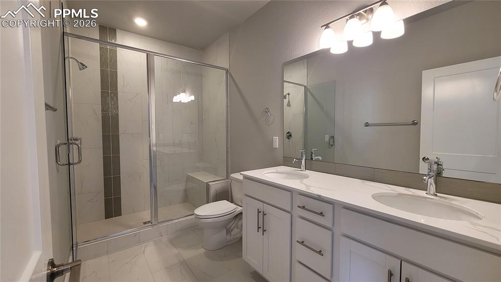 Image 12 of 29: Spacious Primary Suite is accompanied with a plush bathroom and walk-in clo