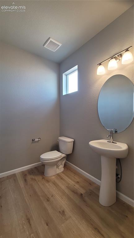 Image 12 of 36: Powder Room, located on the main level!