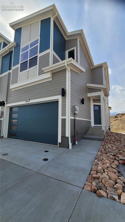 Image 2 of 36: Mountain View-Townhome-End Unit-2 Car Garage-Modern Elevation-Finished Walk